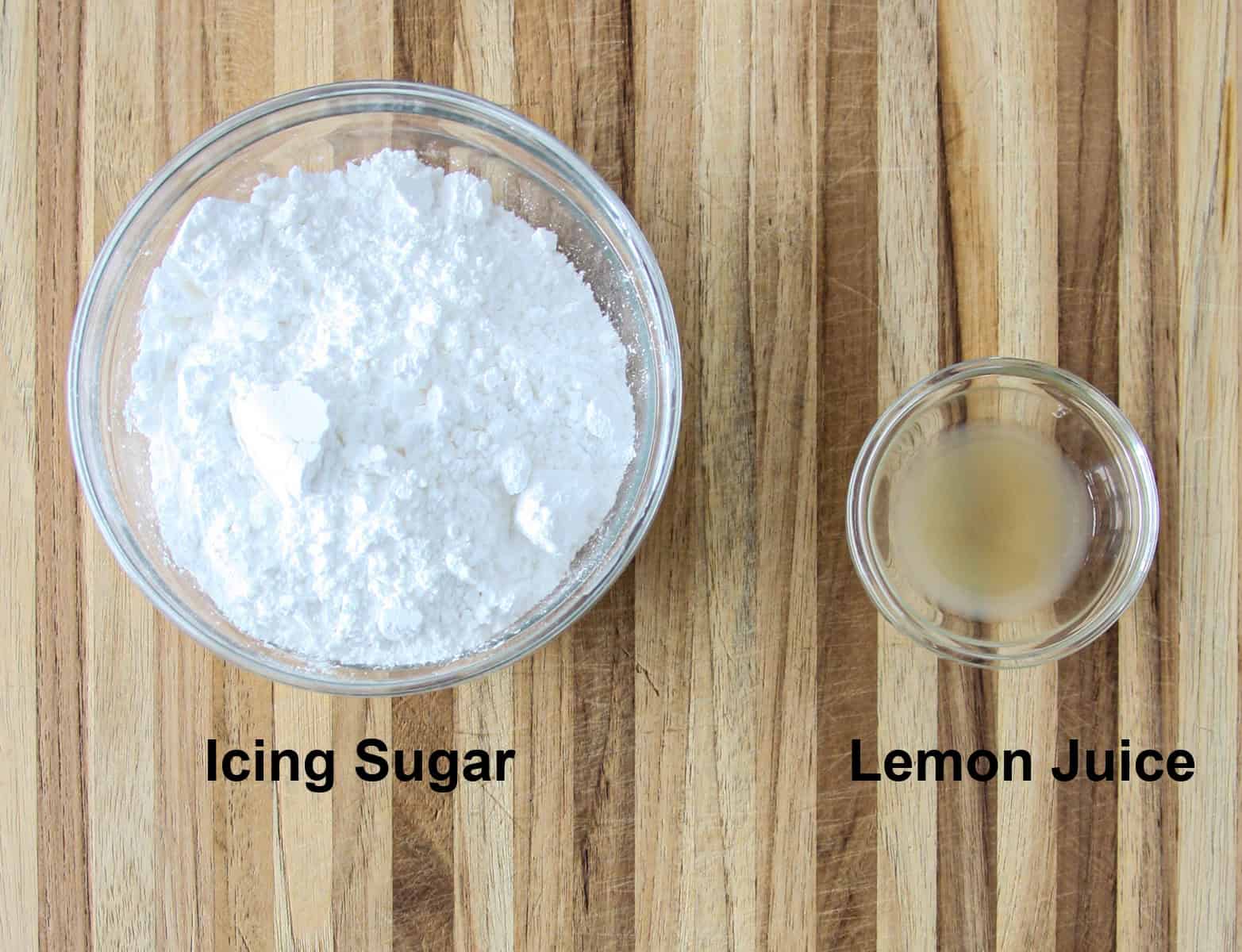 The ingredients for making the lemon glaze, in glass bowls.